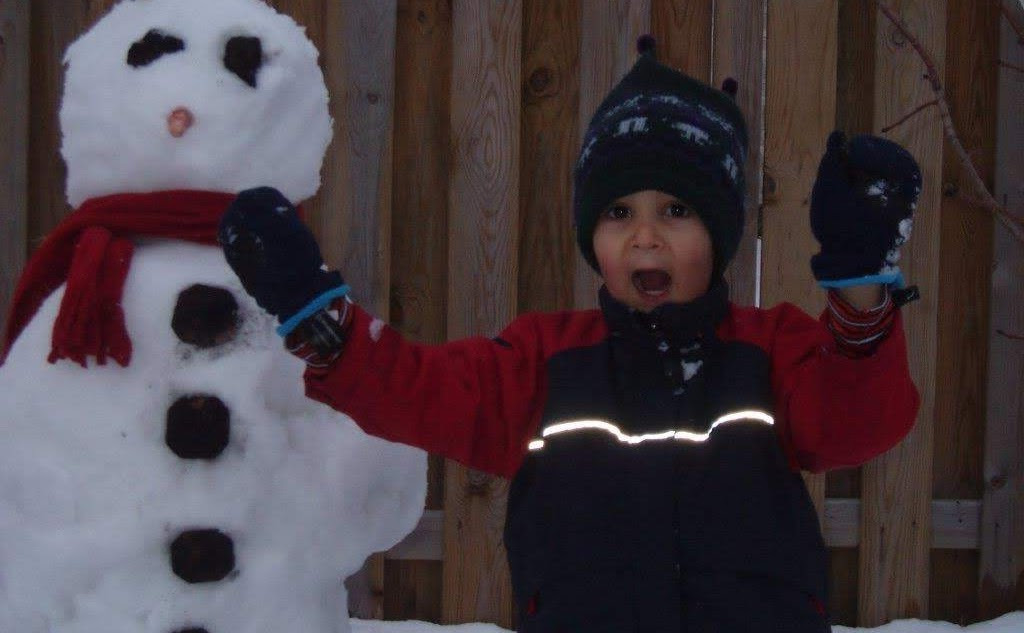 Kieron building a snowman